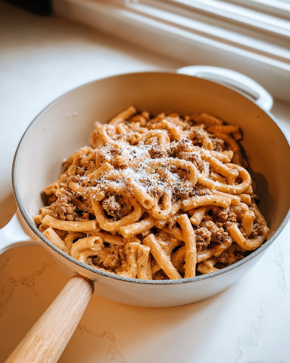 A creamy pasta dish with meat sauce and grated cheese, perfect for quick weeknight dinners from our 20 Genius Pasta Recipes.