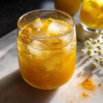 A refreshing golden turmeric elixir with ice in a glass, part of Restaurant-Style Healthy Meals Recipes at Home.