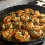 Close-up of juicy, pan-seared shrimp cooked in garlic butter and herbs, a perfect restaurant-style shrimp recipe.