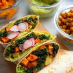 Three delicious wraps filled with sweet potato, kale, avocado, and radish, perfect for sandwich ideas recipes meal prep.