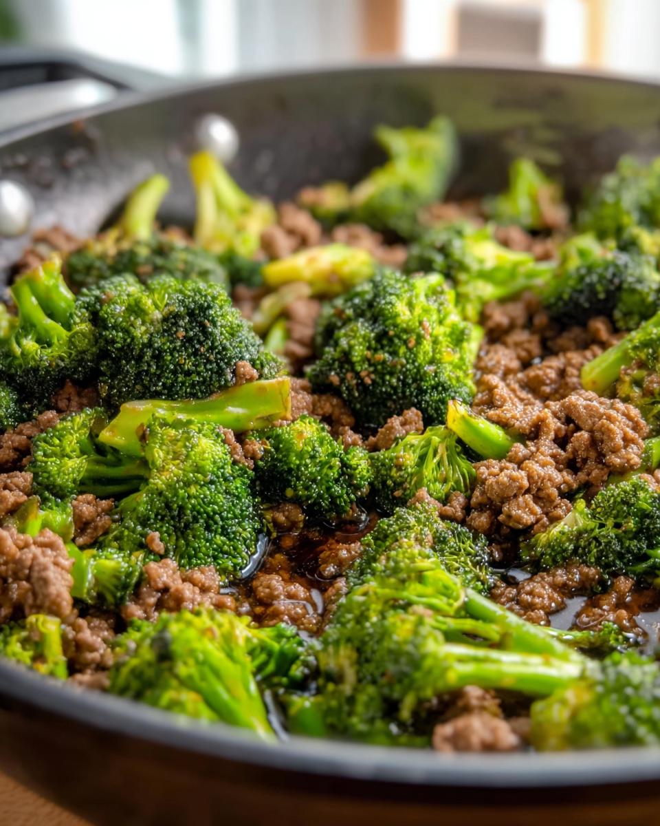 Close-up of a Keto Hamburger Broccoli Skillet with ground beef and vibrant green broccoli florets.