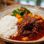 A close-up of a rich Korean Style Pot Roast served with fluffy white rice and vegetables in a rustic bowl.
