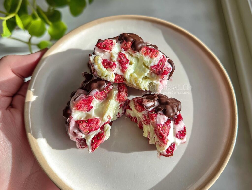 Close-up of Chocolate Strawberry Yogurt Clusters, showing creamy yogurt, dried strawberries, and dark chocolate.